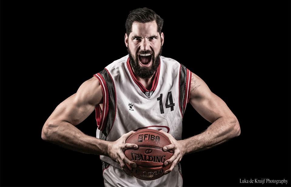 Luke Stone in white #14 jersey mid-roar — pro basketball portrait